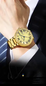 Detail of men's gold skeleton watch with diamond bezel worn with business attire