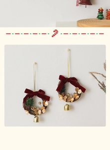 Detailed view of Christmas mini wreaths with velvet bows, pine needles, and gold bells