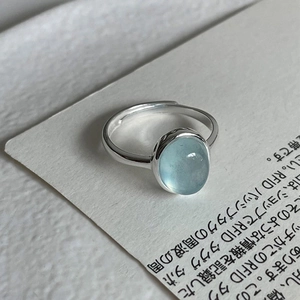 Minimalist S925 silver ring featuring an oval ice blue aurora stone in a sleek design
