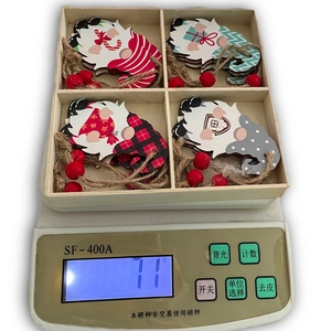 Set of four wooden Christmas gnomes in a wooden box weighing 71g for festive decor