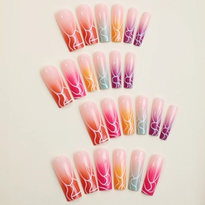 Extra long coffin false nails featuring colorful gradients and white wavy flame patterns