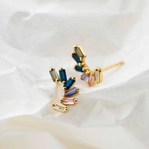 Elegant gold earrings with baguette-cut colorful zircons in a curved minimalist layout