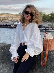 Women's white long sleeve shirt with puff sleeves and ruffle cuffs in linen texture