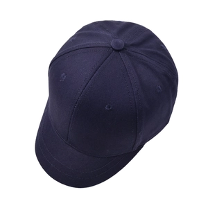 Navy blue short brim baseball cap in minimalist cotton canvas for outdoor sun protection
