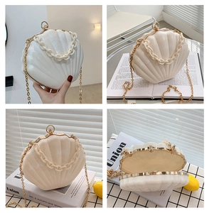 Detailed views of a white acrylic shell clutch with gold metal frame and chain strap