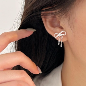 925 Sterling silver bow stud earrings with long chain tassel pendants on model