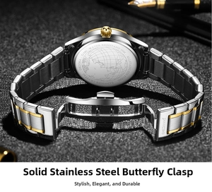 Macro detail of solid steel butterfly buckle and engraved back of the luxury gold watch