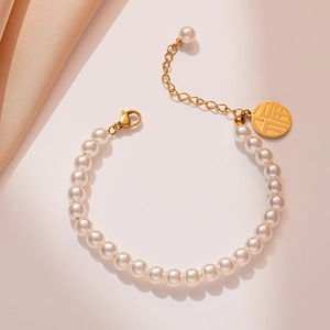 Elegant 18K gold plated pearl bracelet with round Fu character charm and lobster clasp