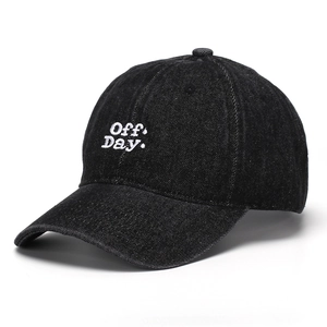 Close-up of Off Day. white embroidery and high-quality denim texture on black baseball cap
