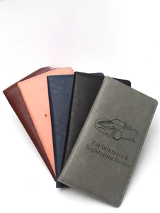 Five assorted leatherette folders for car insurance and registration with car embossing