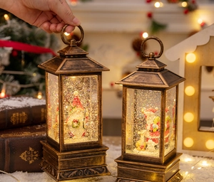 Close-up of vintage bronze Christmas lantern with Santa snow globe and warm LED lighting