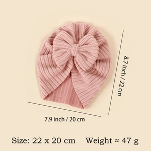 Rosa Strickmütze für Babys im Detail, Größe 22x20cm und 47g Gewicht mit Schleife