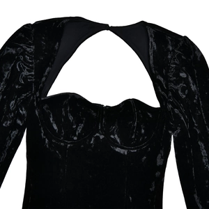 Detail of black velvet long sleeve top with sweetheart neckline and chest cutout