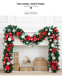 Detail of 270cm PVC Christmas garland with LED lights hung on a white fireplace