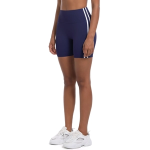 Detail of high-waisted navy blue yoga shorts with double white stripes on the side