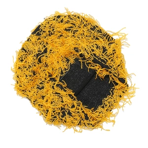 Macro detail of high-contrast yellow and black chunky knit fringe on warm winter beanie hat