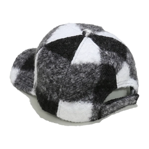 Close-up of black and white checkered sherpa baseball cap with adjustable back strap