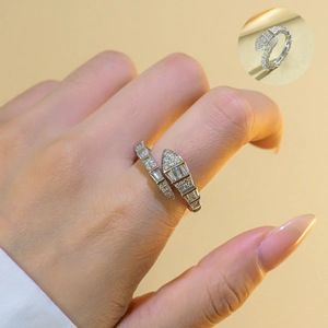 Detailed view of silver snake-shaped ring set with clear cubic zirconia on finger