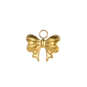 Detailed view of polished golden butterfly pendant with smooth metallic texture and ring bail