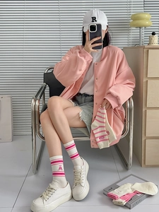 Pink striped mid-calf socks with cute bear embroidery paired with white platform sneakers