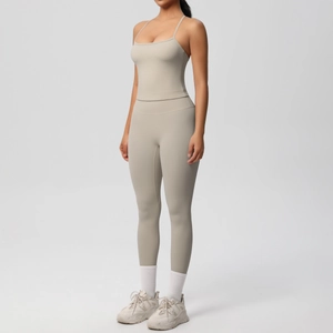 Full view of minimalist beige yoga set featuring sports bra and high-waisted leggings