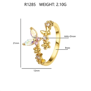 Detail view of brass gold ring with colorful AAA zircon butterfly and flower design