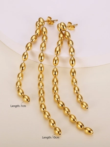 Detail view of gold layered bead chain tassel earrings with 7cm and 10cm length markings