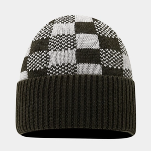 Detail of checkered knit beanie with ribbed cuff in olive green and white tones