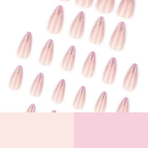 Pink cat-eye press-on nails with almond shape, glitter gradient and golden bows