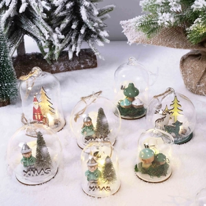 LED lighted Christmas glass globe with Santa and reindeer scenes on wood base