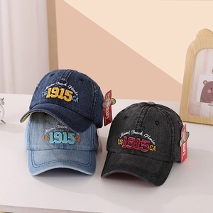 Detailed view of three vintage denim baseball caps with premium Miami Beach embroidery
