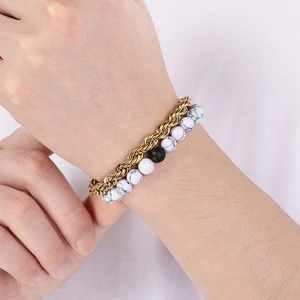 Detail of vintage turquoise and black agate beaded bracelet with gold twist chain