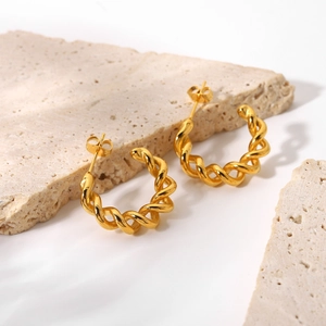 18K gold-plated double-line twisted geometric C-shape hoop earrings on beige stone