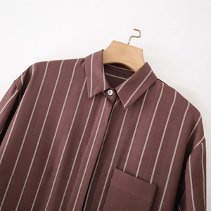 Brown vertical striped long sleeve shirt with lapel collar and chest pocket on hanger