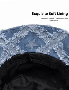Detail of blue denim bucket hat with raw edge star pattern and soft cotton sweatband