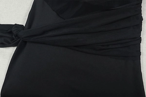 Detail of black elastic fabric and sheer mesh texture on a bodycon maxi dress