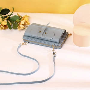 Morandi blue elephant phone bag with metal zippers and detachable strap detail