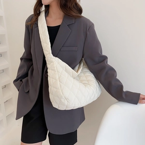 Off-white quilted cloud hobo bag with wide shoulder strap, stylish oversized tote bag