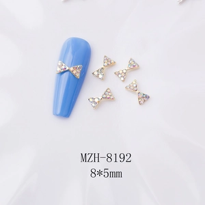 Macro de bijoux à ongles nœuds dorés de 8x5mm avec strass irisés pour nail art