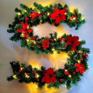 2.7m lighted Christmas garland with red poinsettia flowers and green pine needles