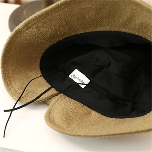 Close-up of the khaki fisherman hat inner lining with adjustable drawstring and stitching