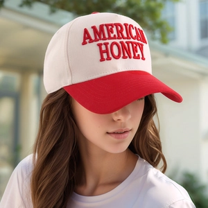 Detail of American Honey 3D embroidery on contrast red and white baseball cap