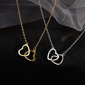 Elegant double interlocking heart pendant necklace in gold and silver finish for women
