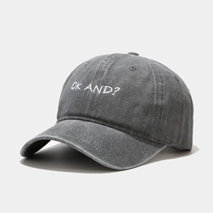 Close-up of vintage washed grey cotton baseball cap with white OK AND embroidery detail