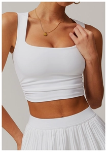 Detailed view of white square neck sports vest with side pleat design and high texture