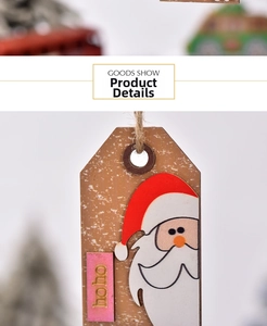 Detail of wooden Christmas Santa hanger with gold hoho lettering and rustic hemp rope