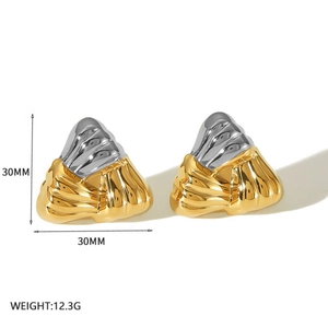 Detailed view of 30mm geometric textured titanium steel earrings with two-tone finish