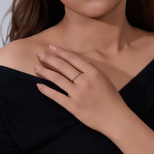 Close-up of a delicate S925 silver band featuring multi-color micro-pave cubic zirconia