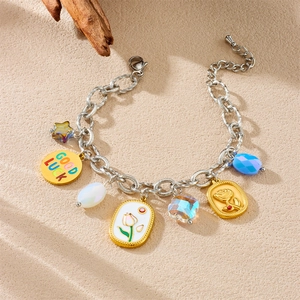Gold and silver chain bracelet with five-pointed star, tulip and rose flower charms
