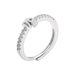 Close-up of Virgo zodiac symbol ring with micro-pave cubic zirconia on adjustable band